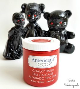 5 figurines from thrift stores painted black with red eyes as creepy haunted Halloween decor Sadie Seasongoods