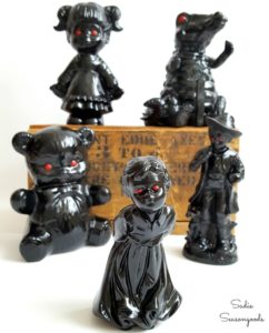 6 figurines from thrift stores painted black with red eyes repurposed upcycled creepy haunted Halloween decor Sadie Seasongoods