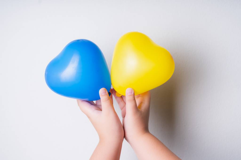 heart shaped balloons represent sign down syndrome children