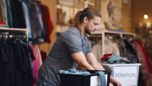 Thrift store employee sorting donations