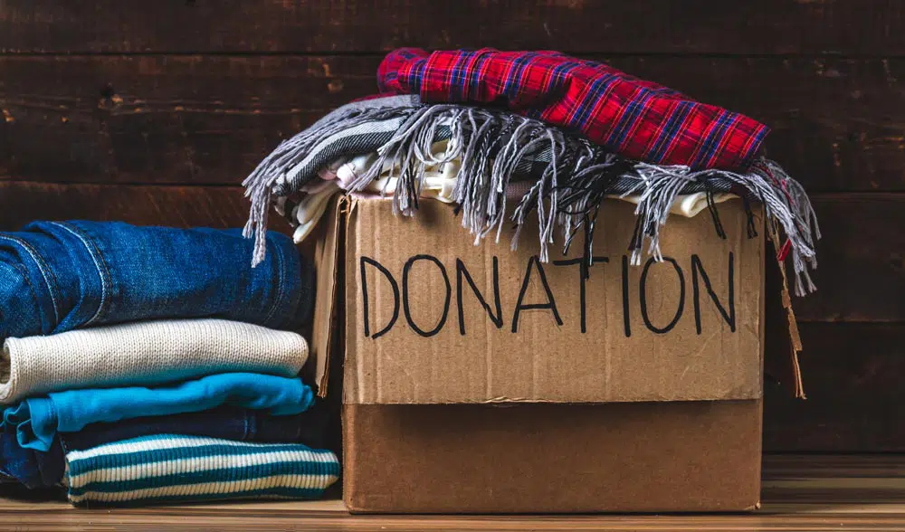 Box of blanket and clothing donations for Goodwill