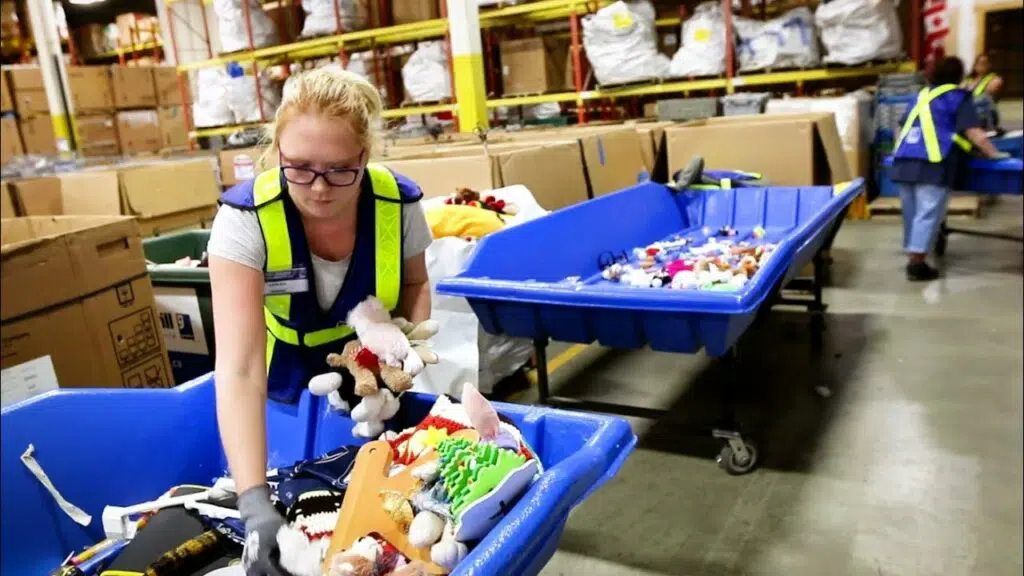 Goodwill employees sorting item and clothing donations