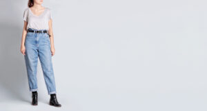 Woman wearing baggy jeans from Goodwill for newest thrifting fashion