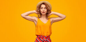 Woman wearing a colourful outfit she thrifted at Goodwill for Summer 2022