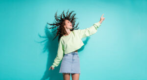 Woman dancing in a micro skirt she bought at a thrift store in Alberta
