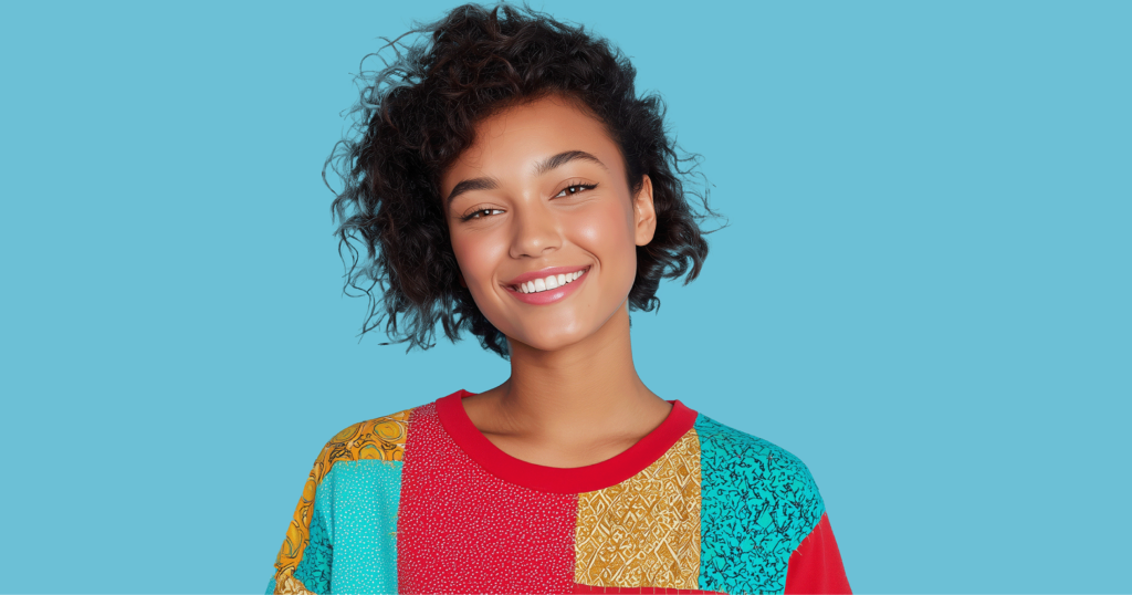 8 TikTok Fashion Trends You Can Thrift 7 Woman wearing upcycled patchwork sweater created using thrifted items from Goodwill